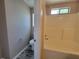 A bathroom features a tub-shower, a toilet, and a small window for light at 5820 Wellborn Oaks Ct, Lithonia, GA 30058