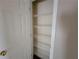 A narrow closet features multiple wire shelves providing optimal storage at 5820 Wellborn Oaks Ct, Lithonia, GA 30058