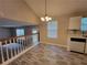 Charming dining room with new flooring, a chandelier, and views into the living room at 5820 Wellborn Oaks Ct, Lithonia, GA 30058