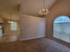 Open-concept dining room featuring a chandelier and views into the adjacent rooms at 5820 Wellborn Oaks Ct, Lithonia, GA 30058