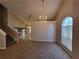 Dining room with vaulted ceilings, a chandelier, and access to the living room at 5820 Wellborn Oaks Ct, Lithonia, GA 30058