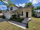 Two-story home with a garage and a well-maintained front yard on a sunny day at 5820 Wellborn Oaks Ct, Lithonia, GA 30058