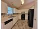 Functional kitchen with white cabinets, laminate countertops, and modern appliances at 5820 Wellborn Oaks Ct, Lithonia, GA 30058