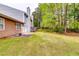 Well-maintained backyard with lush green grass and a cozy patio area at 3620 Spring Trce, Decatur, GA 30034