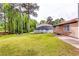 Serene backyard features mature trees providing shade and privacy at 3620 Spring Trce, Decatur, GA 30034