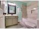 Bright bathroom featuring modern vanity, shower over tub and tiled walls at 3620 Spring Trce, Decatur, GA 30034