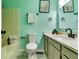 Well-maintained bathroom featuring a shower, toilet, sink, and vanity at 3620 Spring Trce, Decatur, GA 30034