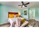 Comfortable bedroom featuring a ceiling fan, access to an ensuite bathroom, and ample space at 3620 Spring Trce, Decatur, GA 30034