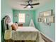 Cozy bedroom featuring charming decor and a ceiling fan for added comfort at 3620 Spring Trce, Decatur, GA 30034