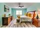 Light-filled bedroom featuring stylish furnishings, a ceiling fan, and neutral tones at 3620 Spring Trce, Decatur, GA 30034