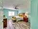 Cozy bedroom with a ceiling fan, warm colors, and natural light at 3620 Spring Trce, Decatur, GA 30034