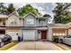 Charming townhome featuring a one-car garage, neutral colors and brick accents at 3620 Spring Trce, Decatur, GA 30034