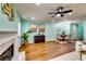 Open concept living room and dining area featuring hardwood floors, fireplace and modern decor at 3620 Spring Trce, Decatur, GA 30034