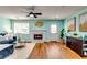Inviting living room with fireplace, hardwood floors, modern décor and plenty of natural light at 3620 Spring Trce, Decatur, GA 30034