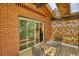 Relax on the balcony with a view of the trees and outdoor seating at 151 Rockmart Dr Sw, Atlanta, GA 30314