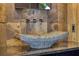 Bathroom featuring a vessel sink, stone countertop, modern faucet, and natural stone accent wall at 151 Rockmart Dr Sw, Atlanta, GA 30314