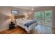 Bedroom featuring a walkout deck with seating, hardwood floors, and neutral color palette at 151 Rockmart Dr Sw, Atlanta, GA 30314