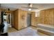 Unique bedroom featuring natural wood paneled walls and tile flooring throughout at 151 Rockmart Dr Sw, Atlanta, GA 30314