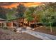Sunset view of stunning home with outdoor patio and balconies surrounded by nature at 151 Rockmart Dr Sw, Atlanta, GA 30314