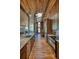Modern kitchen showcasing stainless steel appliances, sleek cabinets, granite countertops, and an open layout with hardwood floors at 151 Rockmart Dr Sw, Atlanta, GA 30314