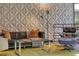 Living room with a statement wall, modern furniture, and ample natural light at 151 Rockmart Dr Sw, Atlanta, GA 30314
