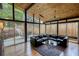 Bright living room with hardwood floors, floor-to-ceiling windows, and access to an outdoor patio with a landscaped backyard at 151 Rockmart Dr Sw, Atlanta, GA 30314