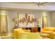 Bright living room with yellow armchairs, unique art, and accent lamps creates a warm and inviting space at 151 Rockmart Dr Sw, Atlanta, GA 30314