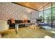 Modern living room featuring high ceilings, textured walls, and stylish furnishings at 151 Rockmart Dr Sw, Atlanta, GA 30314