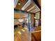 A bright living room with skylights, wood ceiling, hardwood floors, and floor-to-ceiling windows providing plenty of natural light at 151 Rockmart Dr Sw, Atlanta, GA 30314