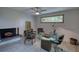 Office space with a fireplace, a window with natural light and a glass desk at 151 Rockmart Dr Sw, Atlanta, GA 30314