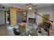 Bright office space with a glass desk, leather chairs, fireplace, and wood paneling at 151 Rockmart Dr Sw, Atlanta, GA 30314