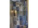 Shower with multi-colored stone tile surround, built-in niche, and modern fixtures creates a spa-like retreat at 151 Rockmart Dr Sw, Atlanta, GA 30314
