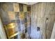 Modern shower with natural stone tiles and open design with rainfall shower head at 151 Rockmart Dr Sw, Atlanta, GA 30314