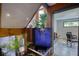 Interior water feature with blue tile, lush plants, and stylish lighting, adds tranquility at 151 Rockmart Dr Sw, Atlanta, GA 30314
