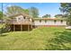 A large backyard featuring a spacious deck with seating, perfect for outdoor enjoyment and entertaining at 645 Camp Perrin Rd, Lawrenceville, GA 30043