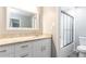 This bathroom features a large mirror and vanity with storage, with a tiled shower and tub combo at 725 Dalrymple Rd # 3G, Atlanta, GA 30328