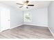 This bedroom features lots of natural light, vinyl floors, and a neutral color palette at 725 Dalrymple Rd # 3G, Atlanta, GA 30328