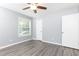 A serene bedroom with gray walls, new flooring, ample natural light, and closet at 725 Dalrymple Rd # 3G, Atlanta, GA 30328
