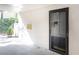 Close up view of a front door with secure black metal frame in a covered entryway at 725 Dalrymple Rd # 3G, Atlanta, GA 30328
