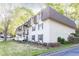 The condo building has beautiful landscaping and a grill for outdoor cooking at 725 Dalrymple Rd # 3G, Atlanta, GA 30328