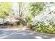 Beautiful community entrance with lovely landscaping and a charming entryway at 725 Dalrymple Rd # 3G, Atlanta, GA 30328