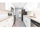 A modern kitchen features stainless appliances, granite countertops, and a tiled backsplash at 725 Dalrymple Rd # 3G, Atlanta, GA 30328