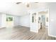 A spacious living room and kitchen area with sliding glass door and stainless appliances at 725 Dalrymple Rd # 3G, Atlanta, GA 30328