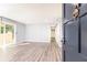 Bright and airy living room showcasing freshly painted walls, new flooring, and sliding door to outdoor patio at 725 Dalrymple Rd # 3G, Atlanta, GA 30328