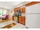 Kitchen with stainless steel appliances, wood cabinets, and view of the dining area at 8495 Spivey Village Way, Jonesboro, GA 30236