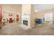 Inviting living room featuring a fireplace, neutral carpet, and views into other rooms at 8495 Spivey Village Way, Jonesboro, GA 30236
