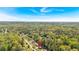 High aerial perspective showcases this home in a verdant neighborhood with mature trees and manicured lawns at 3393 Ridgecrest Dr, Powder Springs, GA 30127