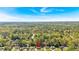 An aerial shot of the property set amongst a lush green landscape with other homes nearby at 3393 Ridgecrest Dr, Powder Springs, GA 30127