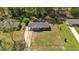 Aerial view showcasing the home's well-maintained yard, long driveway and serene, wooded surroundings at 3393 Ridgecrest Dr, Powder Springs, GA 30127
