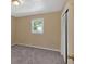 Cozy bedroom with neutral-toned walls, plush carpeting, natural light and a closet for ample storage at 3393 Ridgecrest Dr, Powder Springs, GA 30127